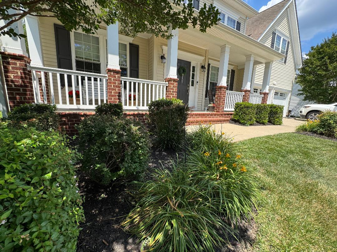 Tidy front-porch landscaping with crisp mulch lines